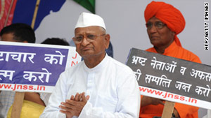 Activist Anna Hazare sits on a platform in New Delhi on April 5 after ...