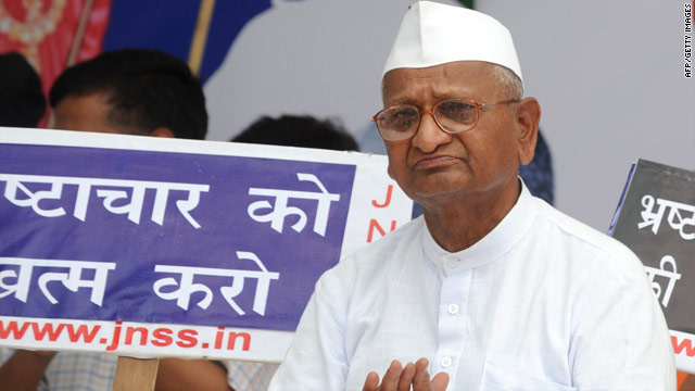 Activist Anna Hazare sits on a platform in New Delhi on April 5 after beginning a "fast-unto-death" against corruption.
