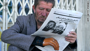 An Afghan man reads a newspaper, which features the fake picture of Osama bin Laden, in Kabul on Tuesday.