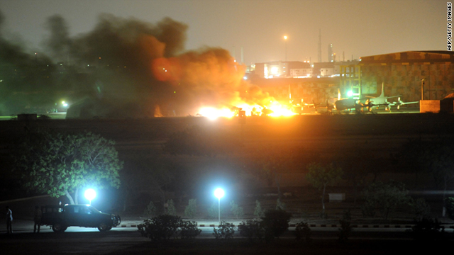 Flames and smokes erupt from the military air base after the attack by militants in Karachi on Sunday.