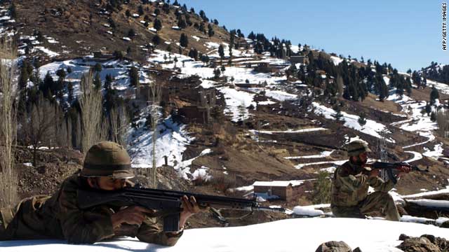 Pakistani soldiers take position at the military check post of Pash Ziarat, a town of North Waziristan, on March 8, 2011.