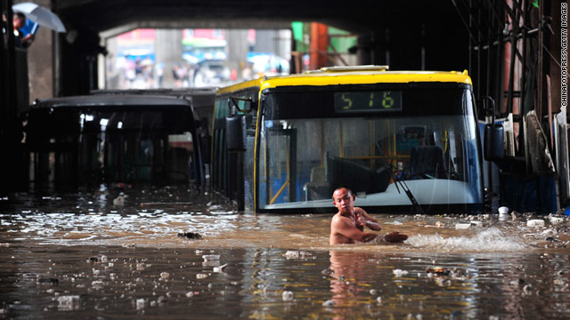 Vehicles trapped in a flooded street after heavy rainfall in the Chinese province of Hubei on Saturday.