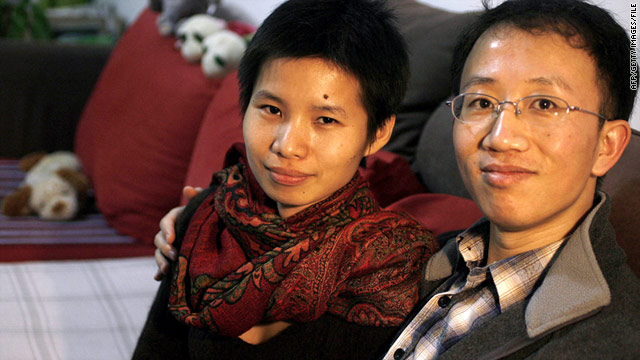 Activist Hu Jia and his wife, Zeng Jinyan, pose in their home on the outskirts of Beijing in 2007.