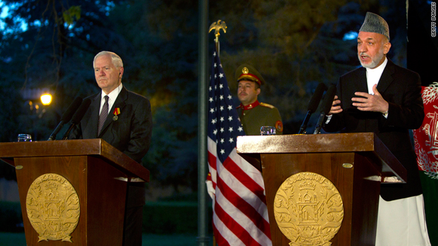 Robert Gates, left, stands alongside Hamid Karzai during a press conference June 4, 2011 in Kabul.