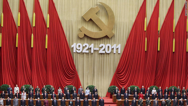 Members of the Communist Party stand and sing the song International during the celebration of the Communist Party's 90th anniversary at the Great Hall of the People on July 1, 2011 in Beijing, China.