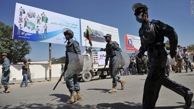 Afghani policemen patrol during a demonstration in Kabul on July 2.