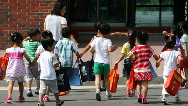 Children, whose parents defected from North Korea, arrive at the Hanawon resettlement facility in South Korea, on July 8, 2009.