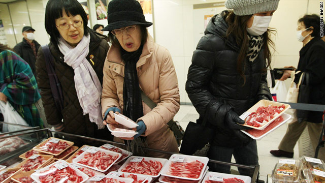 Japanese buy meat at a newly reopened department store in the city of Sendai on March 23, two weeks after the earthquake.