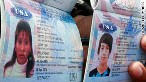 Police show the U.S. passports of Gerfa Yeatts Lunsmann and her son, Kevin, 14, who were kidnapped with a relative.