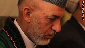 President Hamid Karzai, seen at his half-brother's funeral July 15, condemned the hanging of a boy.