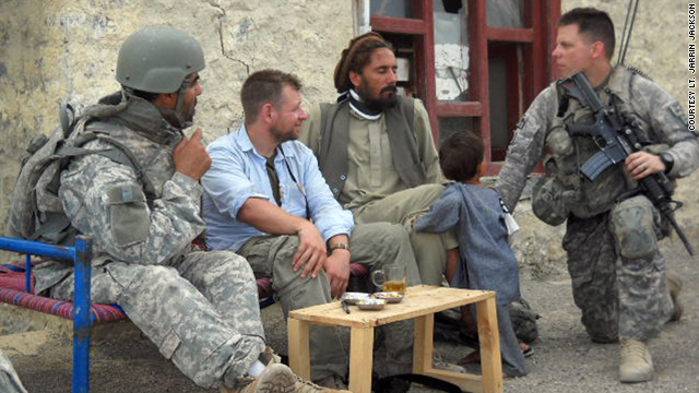 Army Lt. Jarrin Jackson, far right, talks with an Afghan civilian in the insurgent-heavy Khost province.