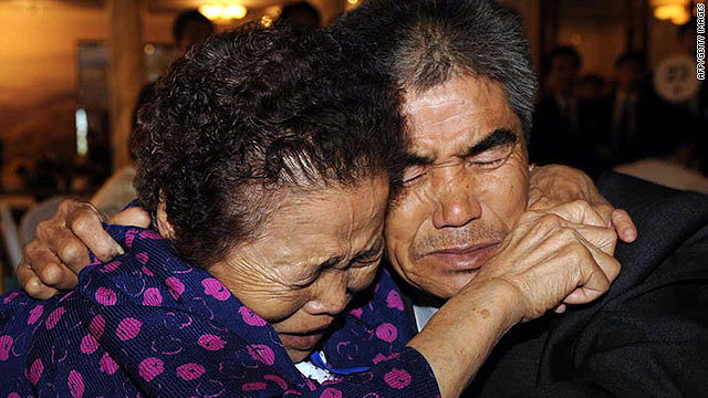 A South Korean mother cries with her North Korean son after meeting at the Mount Kumgang resort, on September 28, 2009.  