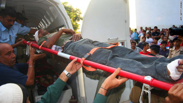 A wounded passenger is moved from an ambulance van to the Government Medical College Hospital in Jammu.