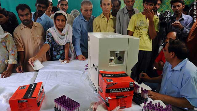 Pakistanis give blood samples at a dengue fever medical camp in Lahore on September 13, 2011.