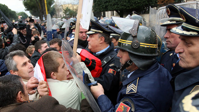 Albanian demonstrators clash with riot police during an anti-government protest in Tirana on January 21, 2011.