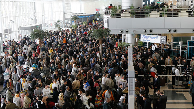 Large crowds looking for flights out of Egypt wait in the halls of Cairo International Airport on February 1, 2011.
