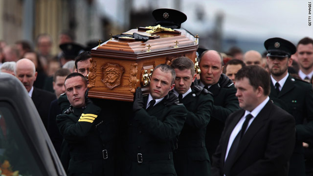 Police officers carry the coffin of Constable Ronan Kerr on Wednesday in Beragh, Northern Ireland. Kerr was killed by a bomb.