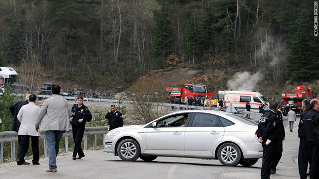 Police inspect the site of an attack on a convoy connected with Recep Tayyip Erdogan on Wednesday.