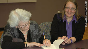 Co-editors Rochelle Saidel, left, and Sonja Hedgepeth sign copies of their book at a Brandeis University event.