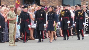 Prince William and Catherine, Duchess of Cambridge, Saturday in Windsor, on their way to a medal parade.