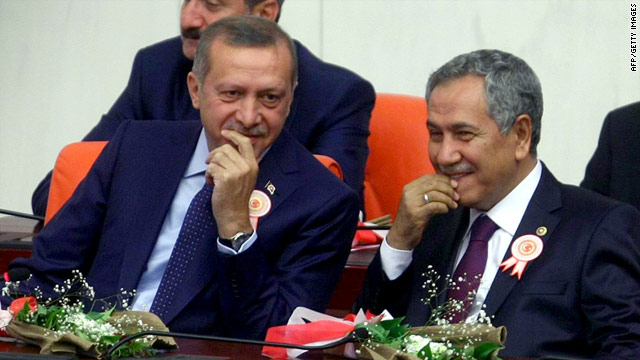 Turkey's Prime Minister Recep Tayyip Erdogan (left) chats with Bulent Arinc during the swearing-in ceremony in parliament.
