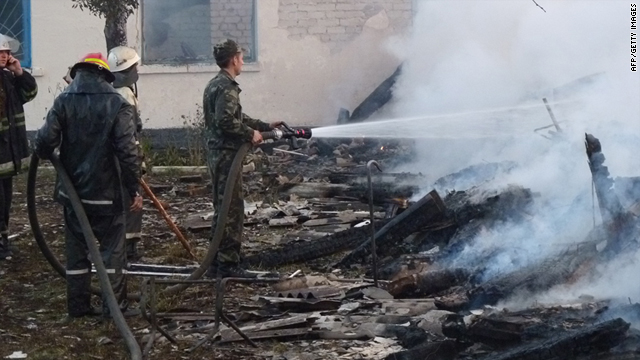Firefighters fight a fire at a retirement home in the village of Bile in the Rivne region of the Ukraine on Sunday.