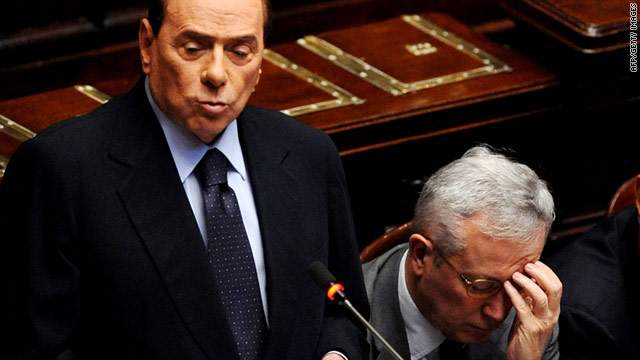 Silvio Berlusconi delivers a speech about the Italian economic situation next to Finance Minister Giulio Tremonti in parliament