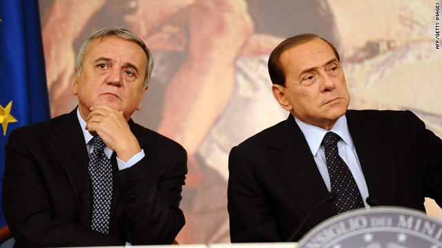Italian Prime Minister Silvio Berlusconi, right, and Labour Minister Maurizio Sacconi discuss Italy's slumping economy.
