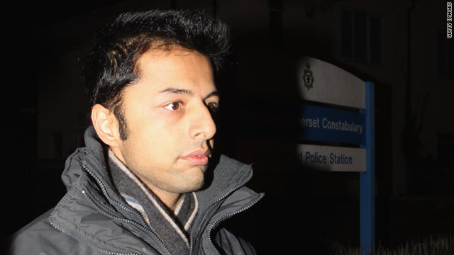 Shrien Dewani leaves Southmead Police station, England, escorted by police officers in December 2010.