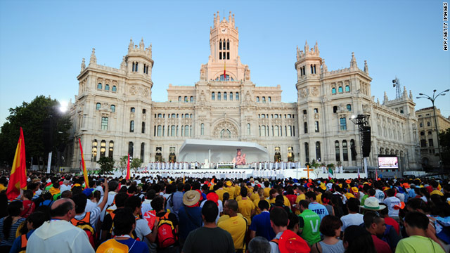 Pilgrims attend the inaugural mass of the World Youth Day at Cibeles square in Madrid on August 16.