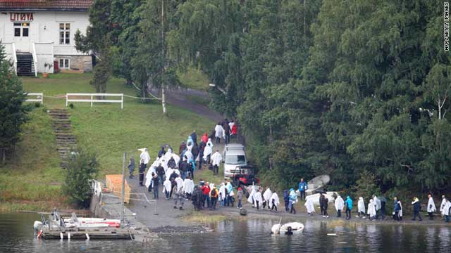 Relatives of the victims killed during a shooting rampage on Utoya island on July 22, 2011 gather on the island on Friday.