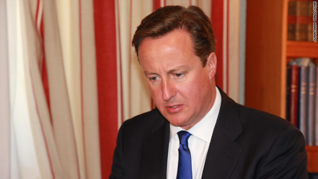British Prime Minister David Cameron has sent a message to Libyan leader Moammar Gadhafi: Give yourself up, it's over.