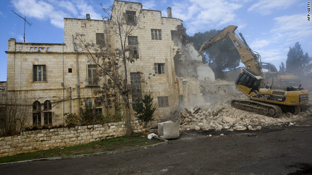 Israeli bulldozers demolish part of the Hotel Shepherd in  East Jerusalem Sunday to make way for 20 new homes for Jews.