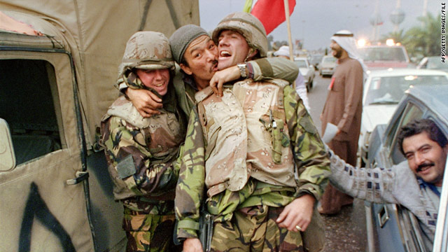 Kuwait residents hug and congratulate U.S. Marines in February 1991 after the U.S. and its allies liberated Kuwait City.