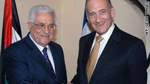 ehud olmert and shimon peres shaking