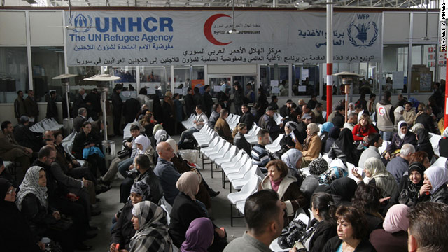 Iraqi refugees wait for aid at the offices of the UN High Commissioner for Refugees in Duma, Syria in December 2010.