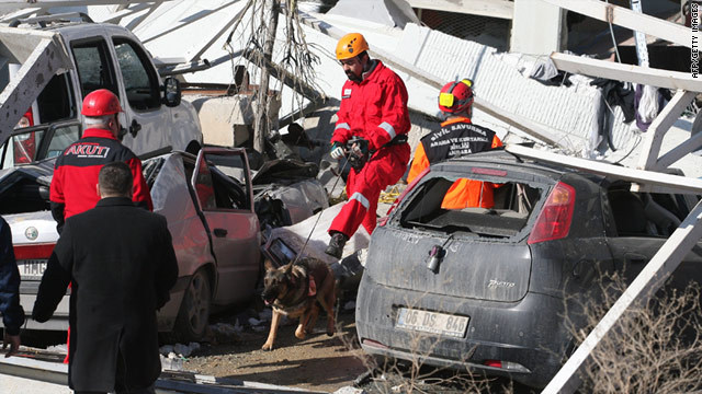 Rescue workers search for survivors after an explosion at a manufacturing facility outside Ankara on February 3, 2011.