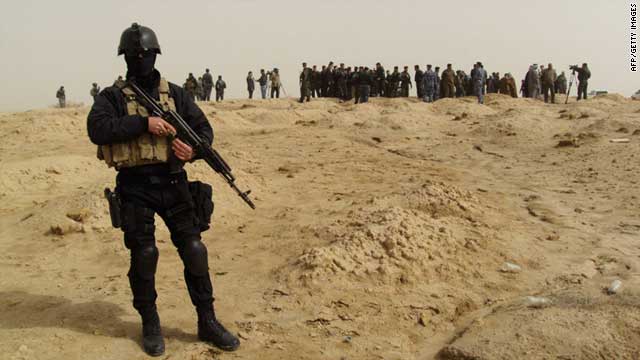 Iraqi authorities uncovered a mass grave with 153 bodies of Al-Qaeda victims, many of them women, children and members of the security forces, police said.