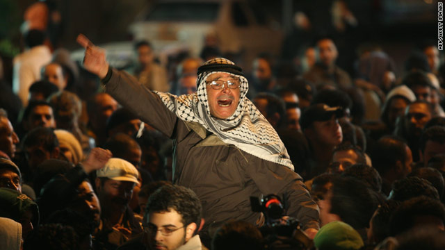 Palestinians in Ramallah on the West Bank celebrate the ouster of Egyptian President Hosni Mubarak on Friday night.