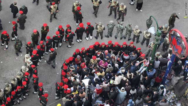Egyptian military police close in around remaining protesters in  Cairo's Tahrir Square on February 14.