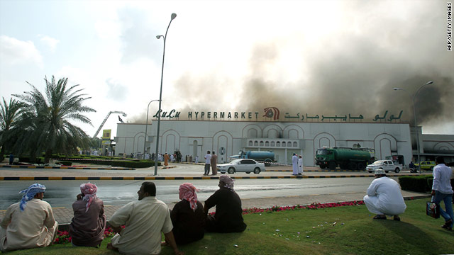 Omani protesters continue to call for more jobs as a hypermarket burns during a demonstration in the town of Sohar. Some believe police killed two protesters for burning shops and cars in the town.