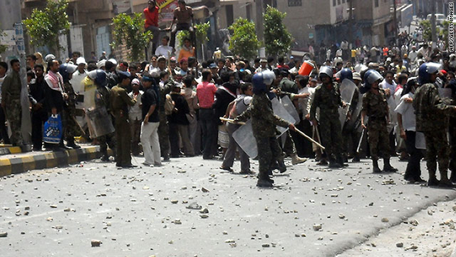 Yemeni anti-government protesters clash with security forces in Taiz, south of Sanaa, on Thursday, March 17.