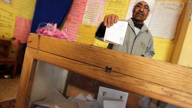 An Egyptian man casts his vote on constitutional changes at a polling station in Mansura on March 19, 2011.