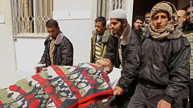 A Palestinian is wheeled at al-Najar hospital in the town of Rafah after being wounded by an Israeli shelling near the city airport.