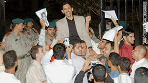 Abdulhadi Al-Khawaja is greeted by supporters after being released from prison in Manama, Bahrain, in November 2004.