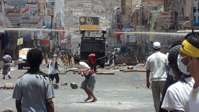 Yemeni security forces use water cannons to disperse anti-government protesters in Taiz on May 9, 2011.