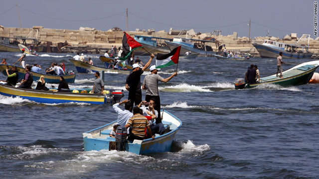 Palestinians rally Monday off the coast of Gaza City to mark the first anniversary of a deadly Israeli raid on a Turkish flotilla.