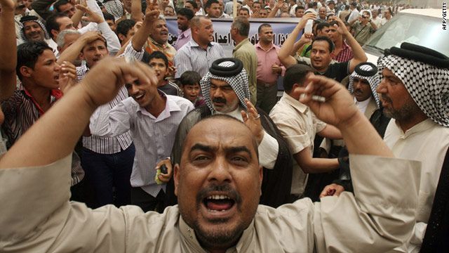 Iraqi men demonstrate in support of Prime Minister Nuri al-Maliki in Baghdad's Tahrir Square on Friday.