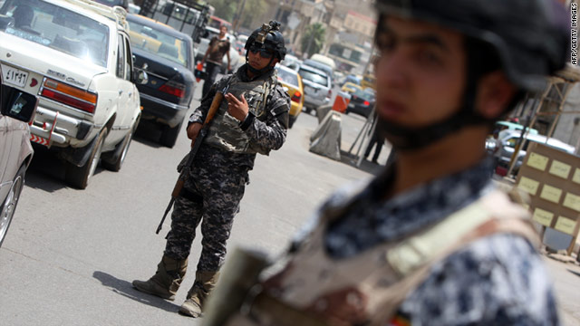 Iraqi policemen man a checkpoint after blasts in June killed five U.S. soldiers and 20 Iraqis Recent attacks Tuesday's have killed at least a further 12.