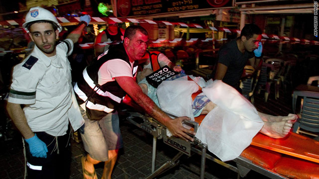 A victim is taken to the hospital after a gas canister exploded in a building in Netanya, Israel, on Thursday.